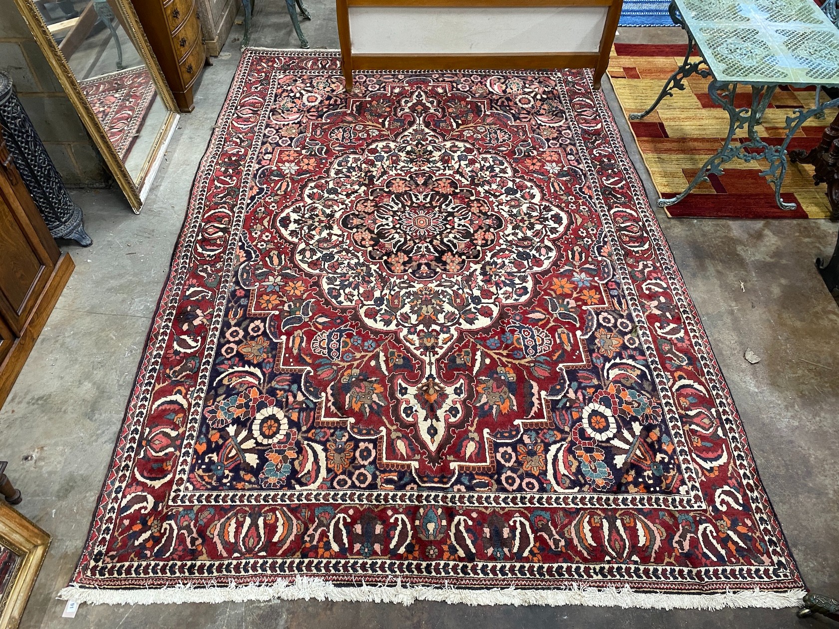 A Mahal burgundy ground carpet, 320 x 210cm